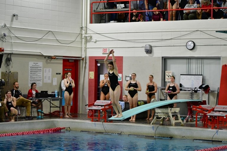 Ava LePage launches from the diving board.