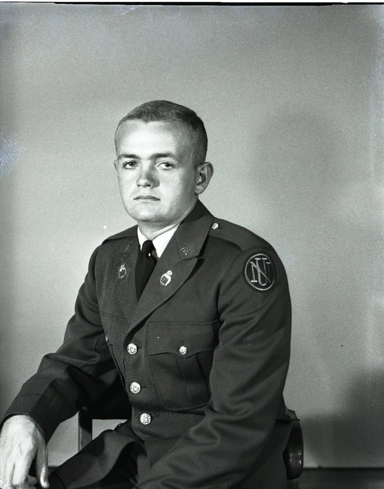 A young cadet takes his formal cadet portrait.