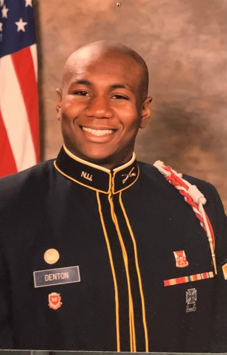 A young cadet smiles in his formal portrait.