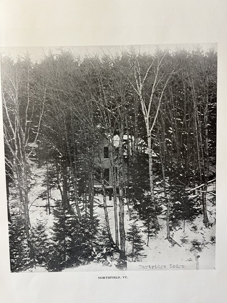 Partridge Lodge stands among snow-covered trees in Northfield, Vermont.