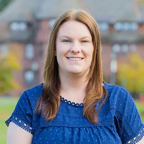 Profile image of smiling Jenna Goodall in blue top