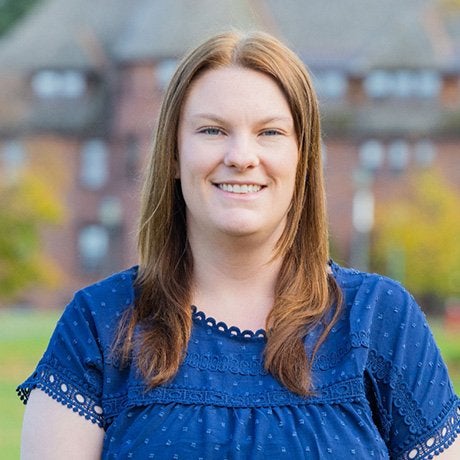 Profile image of smiling Jenna Goodall in blue top