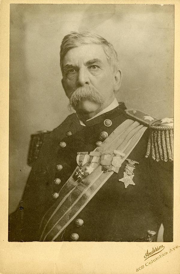 A service member in a decorated military uniform poses for a historical portrait.