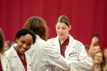Images of the White Coat Ceremony during homecoming week. 