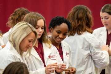 Images of the White Coat Ceremony during homecoming week. 