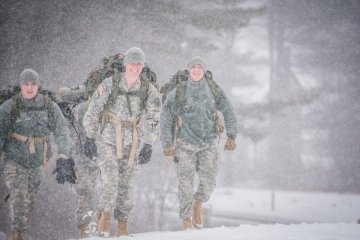 Three Mountain Cold Weather Cadets hiking in snow