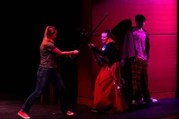 Pegasus Players - She Kills Monsters - Actors on stage engaged in battle