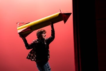 Pegasus Players - She Kills Monsters - Actor on stage holding missile