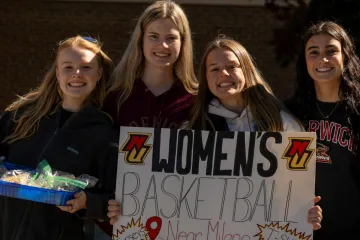 HC25 - Football game crowd, women's basketball teammates, NU vs. ME Maritime