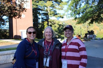 three women alumna near Norwich Carillon at 2025 Homecoming Review with Retreat