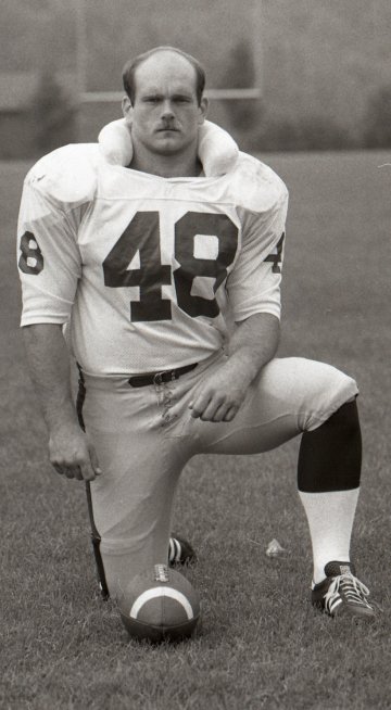 football player posing on one knee, wearing #48, Paul Gretsky NU'81