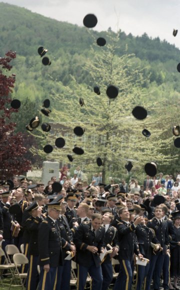 graduating Norwich cadets throw caps in the air