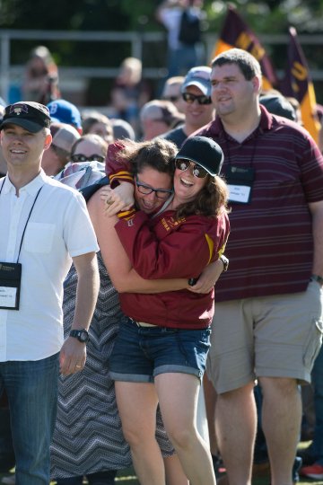 . Jonathan D. Thomas '11 following his wife, Margaret K. Thomas '10.