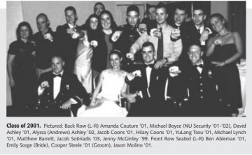 A large group from the Norwich University class of 2001 surround Cooper Steele '01 and his wife Emily on their wedding day. All of the members of the class hold forward their left hand bearing their class rings. From photo found in Norwich RECORD.