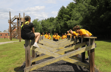 FLC campers learning about the challenge course.