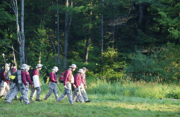 FLC campers walking through the woods.