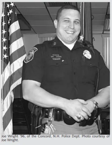 Man smiling in a short-sleeve policeman's shirt. Caption to photo: Joe Wright '96 of the Concord N.H. Police Dept. 
