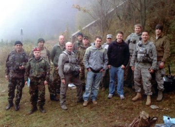 group of 14 military personnel, many in army fatigues, incl. students, Air Force ROTC Cadet Brian Van Hone ’11_Army ROTC Cadet Vince Lally ’11