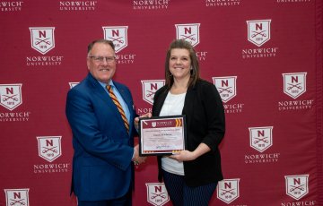 LtGen John J. Broadmeadow '83, USMC (Ret.), presents Vanessa Middleton with her Bowen Award.