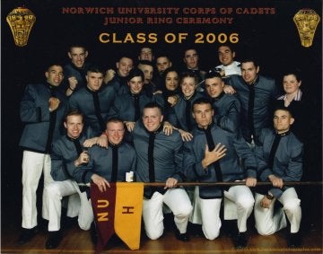A group of individuals in formal military attire kneel and stand, with a banner reading "Class of 2006" appearing above them.