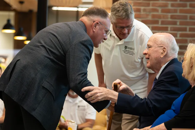 President, LtGen Broadmeadow '83, USMC (Ret.) (Left), Phil Susmann – President of NUARI (Center), and retired US Senator Patrick Leahy (seated Right)